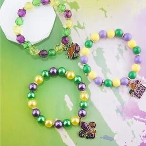 A set of three Mardi Gras bracelets